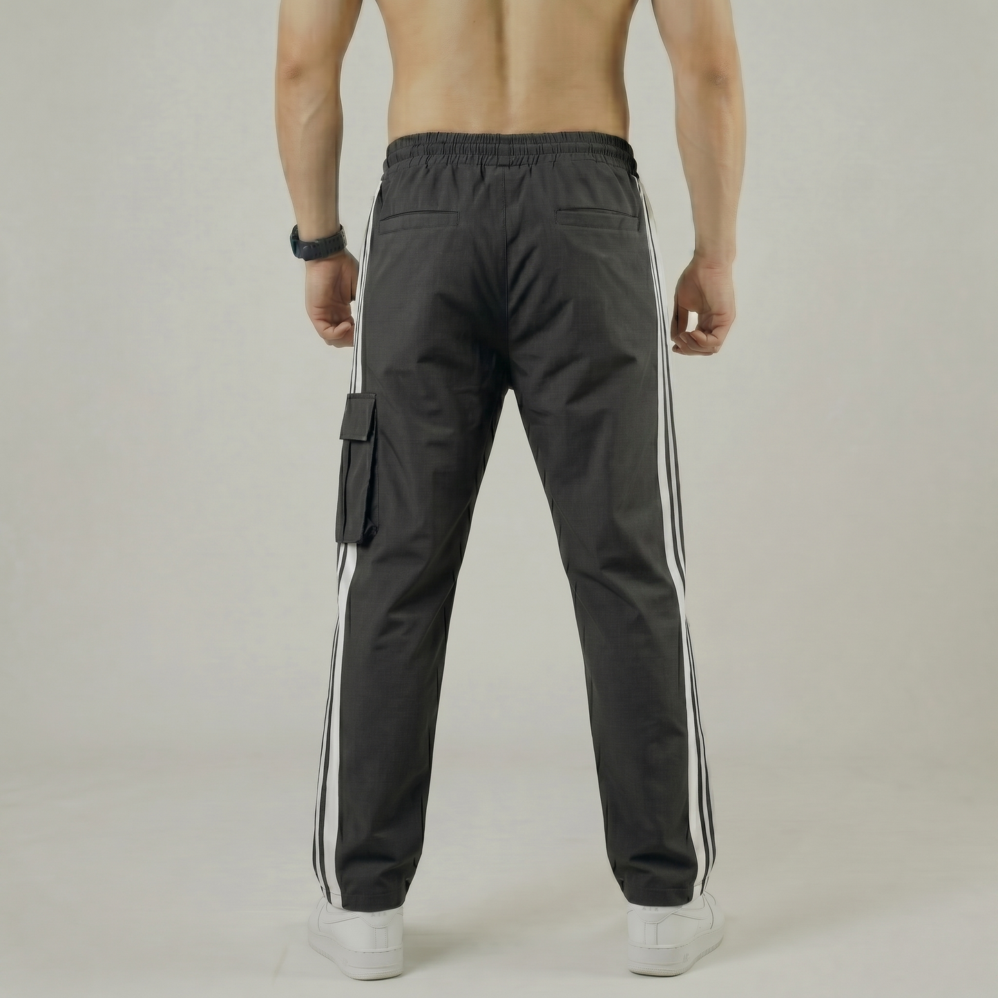 Rear view of tapered charcoal gray gym trousers for men - Pearl Active wear