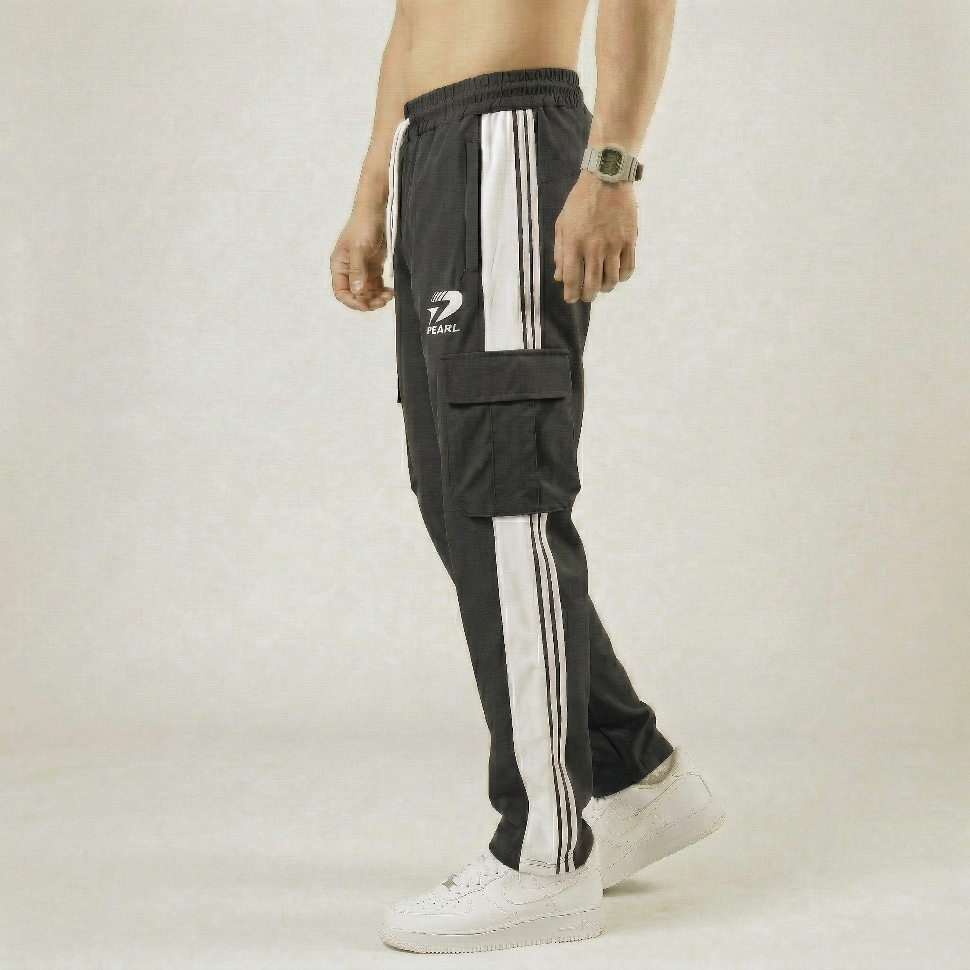 Detail view of single-side utility pocket on charcoal grey cargo joggers - Pearl