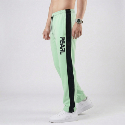 Light green athletic pants with white Pearl branding - Lifestyle view
