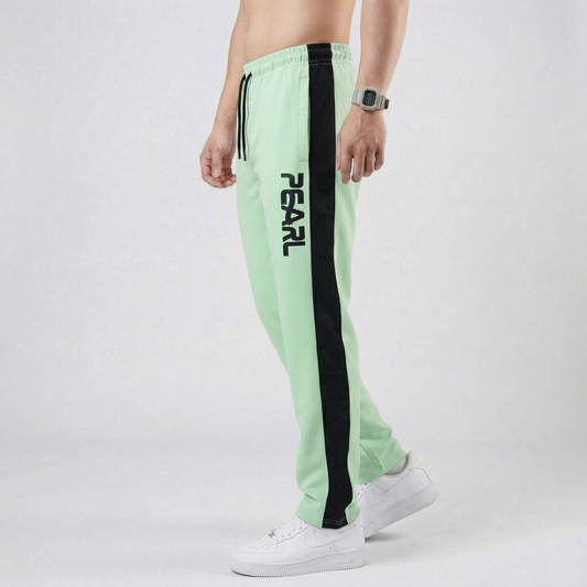 Light green athletic pants with white Pearl branding - Lifestyle view

