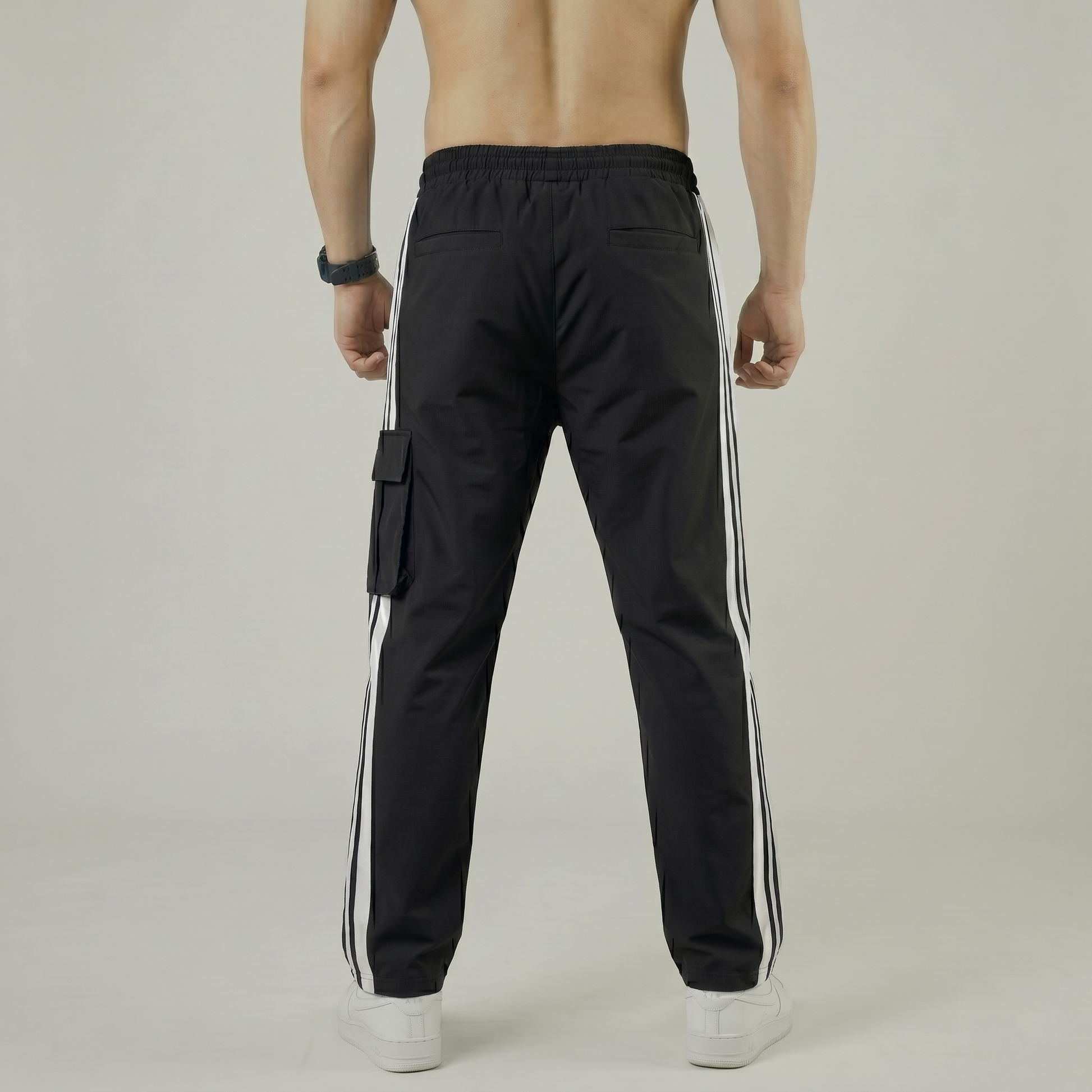 Rear view of tapered black gym trousers for men - Pearl Active wear